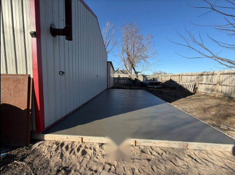 Concrete apron poured alongside a metal building by Twins Concrete in Nebraska
