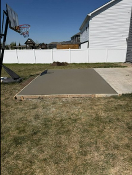 Backyard concrete basketball pad poured by Twins Concrete in Nebraska