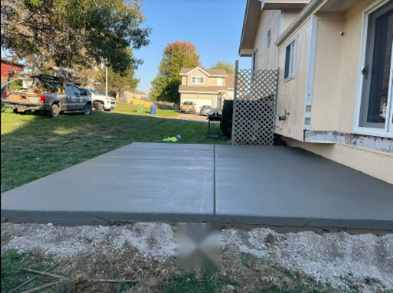 Twins Concrete crew truck at a residential concrete patio project in Nebraska