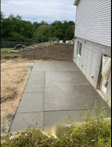 Concrete side patio and walkway completed by Twins Concrete in Nebraska