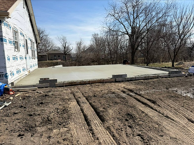 Concrete garage slab poured for a new construction home by Twins Concrete in Nebraska