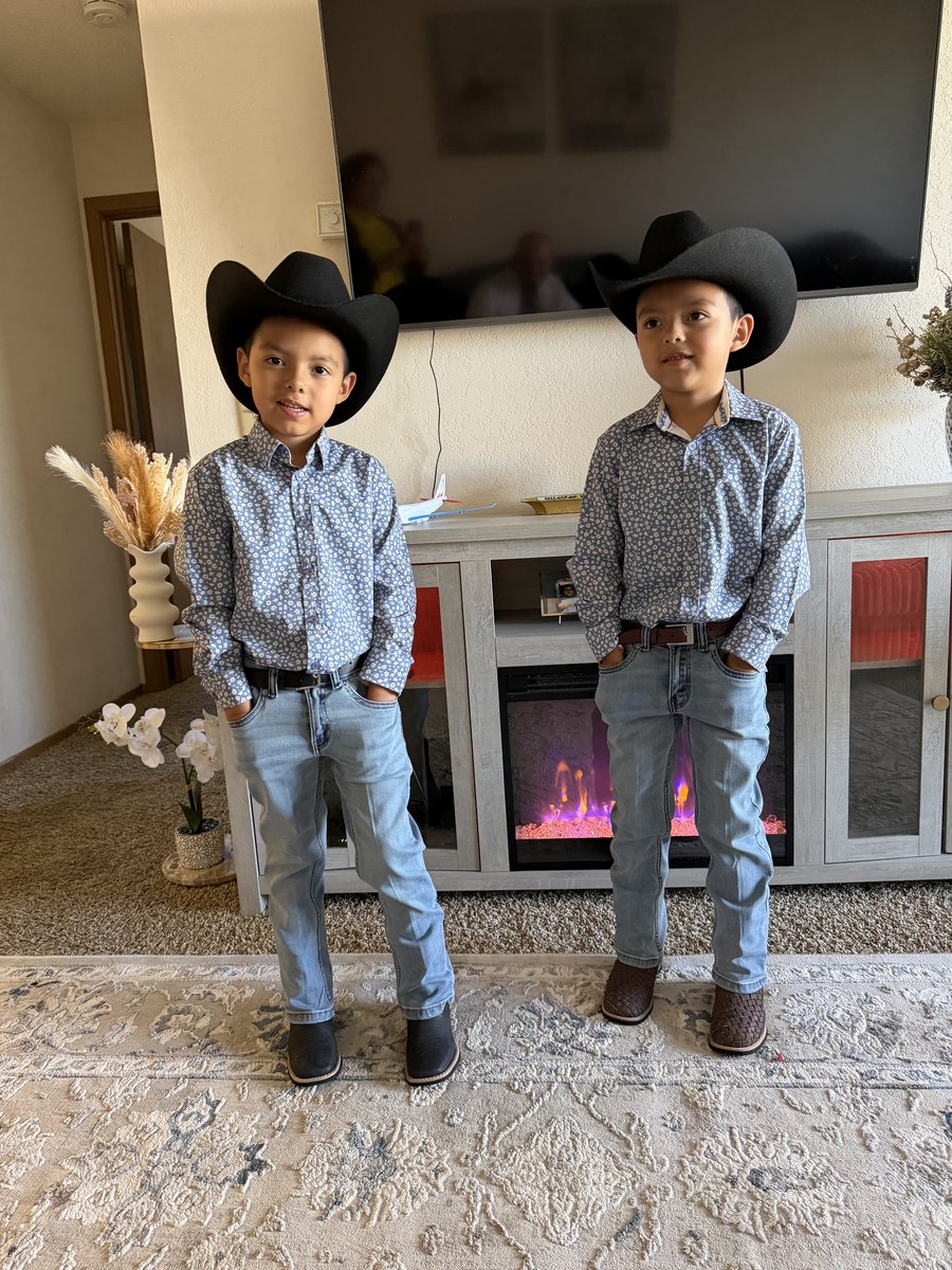 Melvin's twin boys — the namesakes of Twins Concrete LLC — in matching cowboy hats and boots